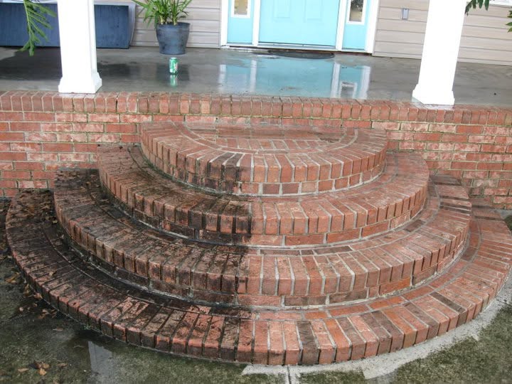 Brick staircase with one side cleaned and one side still dirty